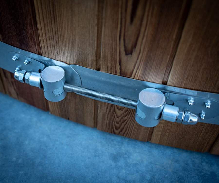 Polished stainless steel fixtures and band on cedar cladding