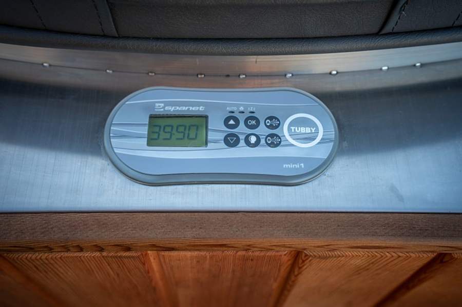 SpaNET touch controller set into the cedar rim of an electric Tubby