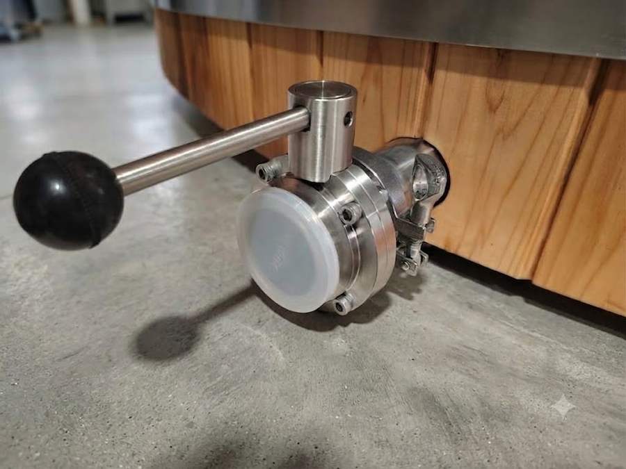Brewery-grade stainless drain valve with lever handle on a Tubby hot tub