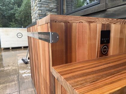 Stainless corner strap and cedar cladding