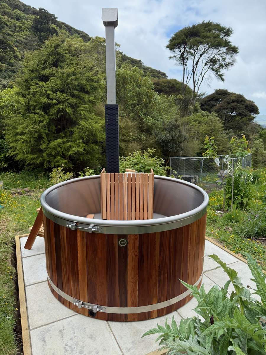 Posh wood-fired hot tub hidden in native bush at Waitati