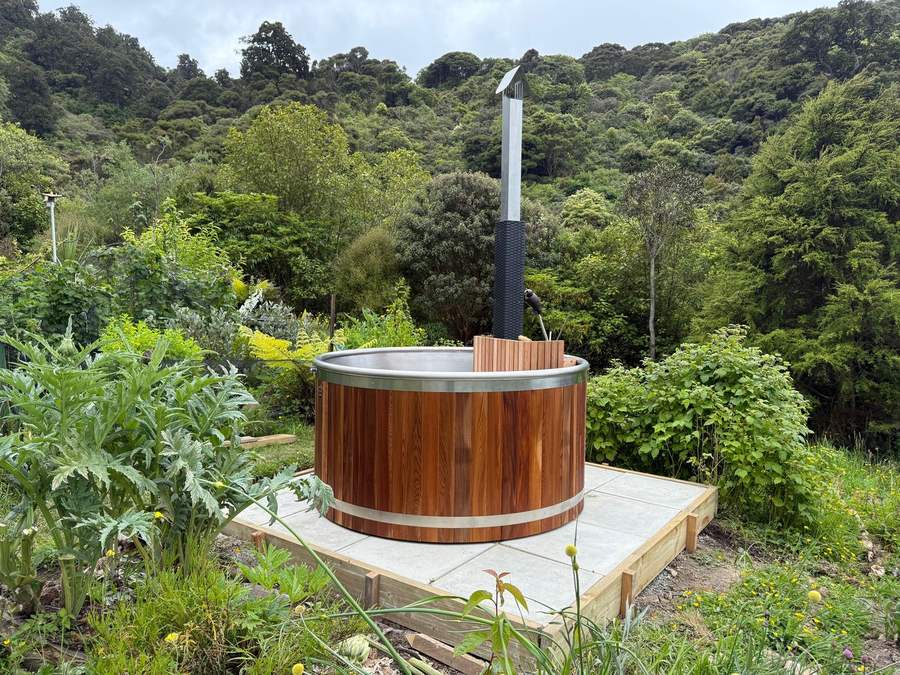 A Posh wood-fired Tubby hot tub overlooking hills near Dunedin
