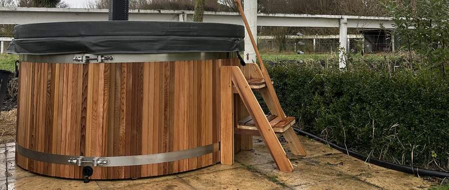 Wood-fired Tubby hot tub with chimney on a Canterbury farm