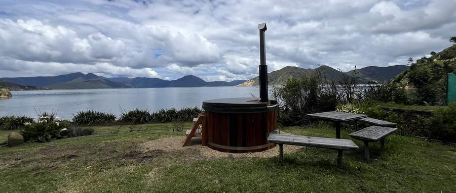Posh hot tub overlooking the Marlborough Sounds coastline